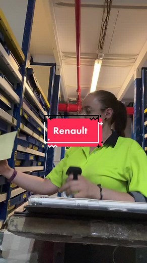 Warehouse Worker Handling Packages in Industrial Setting