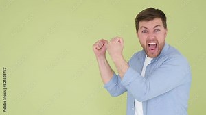 Angry man shouting and waving his arms isolated on background in studio. Nervous man speaks loudly