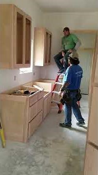 Install kitchen cabinets