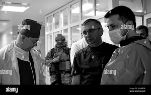 (Kyiv, Ukraine - 13.3.22) President Volodymyr Zelensky of Ukraine walks to a military hospital in Kyiv, Ukraine to visit with soldiers wounded during the Russian invasion, also awarding medals to the combatants and medical personnel for their service to their country. These images are from a video from the Ukraine Presidential Press Office Stock Photo - Alamy