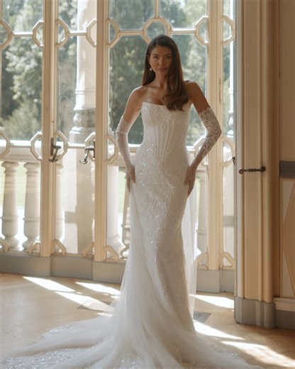 Anna Sposa | Wedding dresses on Instagram: "An elegant sleeveless fitted gown. The elegant design with monogram lace patterns, embroidered with beads and sequins, adds a touch of classic sophistication to the look. The off-shoulder style highlights the bride’s delicacy, while the detachable long train and long gloves bring a royal elegance💓 LAYANAL dress | MAJESTIC CHARM collection Anna Sposa by Anna Sposa Group"