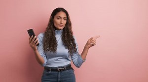 Woman Using Phone Pointing Side Stock Footage Video (100% Royalty-free) 3411455823 | Shutterstock