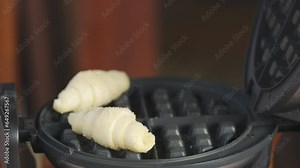 Slow motion 4K illustrating gourmet menus, cooking techniques, of homemade cuisine, delicious croffle. it's for a café, bakery, or any food-related content of process how to making or baking bakery.