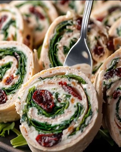 9.9K views · 45 reactions | Homemade Turkey Cranberry Pinwheels Ingredients: 4 burrito-size or wrap-size tortillas 8 ounces cream cheese, softened ½ cup dried cranberries | Optimal Recipes | Facebook