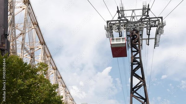 New York City Roosevelt Island tramway to Manhattan Midtown. American aerial cable tram near Queensboro Bridge. Urban public passenger transport, USA. Transportation and architecture in United States.