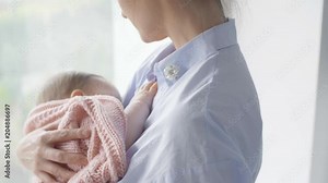 Affectionate woman breastfeeding her baby
