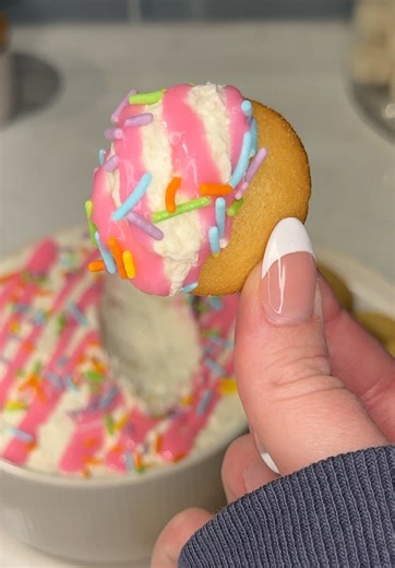 this viral little debbie easter cake dip needs to be on your little treat menu asap 🍰🐰 Ingredients: 6 @Little Debbie® Easter Basket Cakes (crumbled) 1/4 cup milk 1 cup powdered sugar 1/2 stick butter (softened) 8 oz cream cheese (softened) 1 tbs vanilla 1 tub whipped topping pink icing Easter sprinkles wafer cookies (for dipping) Instructions: Beat cream cheese, butter, powdered sugar, vanilla, and milk until smooth, then fold in whipped topping and the crumbled Easter Cakes. Spoon into a dish