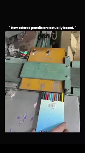 THINK SCROLL on Instagram: "This video captures an automated packaging process used in stationery manufacturing, where colored pencils are aligned, counted, and inserted into boxes by a precision-guided machine. In large-scale production, automation like this is essential to maintain uniform quality, accurate quantity, and high-speed output that manual packing cannot consistently achieve. Sensors and mechanical guides ensure each pencil is positioned correctly, reducing breakage and color mismat