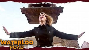 After being turned away from the school, Ralph headed straight for the pub to hatch his revenge. After several pints of Dutch courage, he’s stolen a digger and is heading straight for the school! Having been alerted by Ralph, Rachel arrives in time to see him plough into the front entrance. With Eddie and Melissa yelling at her to stop, she steps in front of the digger. | Waterloo Road