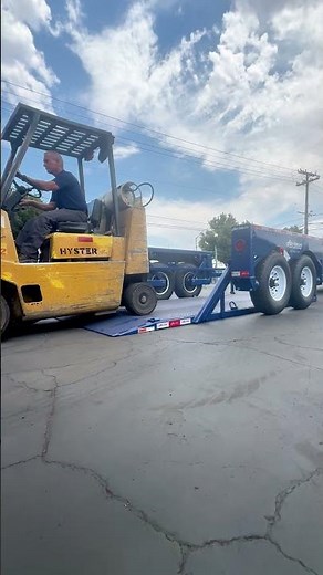 Loading Forklift With Ground-Level Loading Trailer