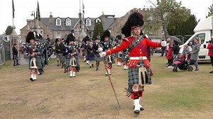 Drum Major Ian Esson and Pipe Major James Cooper leading Ballater & District Pipe Band on the march as they arrived at the 2022 Aboyne Highland Games. These were held on Saturday 6th August 2022 on the green at Aboyne in Deeside, Aberdeenshire, Scotland. The band are playing "I See Mull" as they entered and then "Colin's Cattle" and "Bloody Fields of Flanders". Ballater & District Pipe Band was formed in 1993, with the forerunner being the Ballater Branch Air Training Corps Pipe Band of the 1950