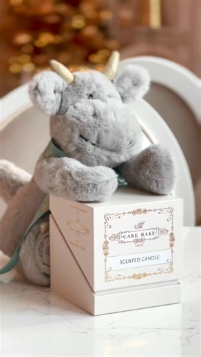 2.5K views · 47 reactions | NEW Merchandise! Fill your home with the sweet scent of The Cake Bake Shop!✨ Brûlée loves lighting his favorite candle while enjoying a sweet treat. Our candle opens with a scent of freshly cut roses, filling any room with a delicate, romantic glow. It’s as lovely to display as it is to light— perfect for your home or a gift! Available now at #DisneysBoardwalk or for global shipping. #TheCakeBakeShop | The Cake Bake Shop by Gwendolyn Rogers | Facebook