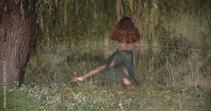 Cosplay of a dryad by a young woman spinning on a hoop, aerial gymnastics, 4k