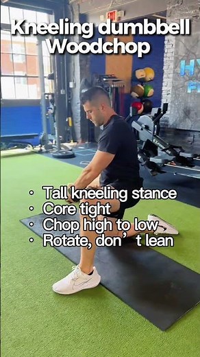 Kneeling dumbbell woodchops are great for building rotational strength and core stability.