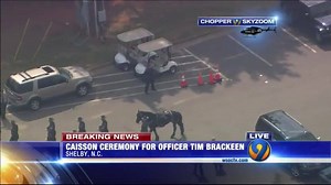 WATCH LIVE: Chopper 9 is flying over the Caisson ceremony before the funeral for fallen Shelby officer Tim Brackeen. FULL COVERAGE: http://on.wsoctv.com/2cwMD7p | WSOC-TV