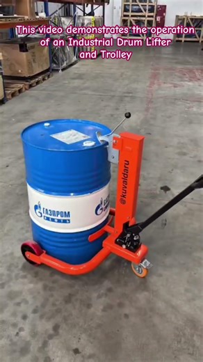 Warehouse Safety: Heavy-Duty Drum Lifter in Action #WarehouseEquipment #IndustrialSafety #Material
