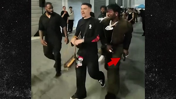 Antonio Brown Runs Through Crowd With What Looks Like Gun