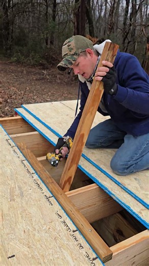 Installing OSB subflooring.