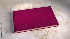 Book opening. Three animated books. Books is opening to the front page. Inside animation: Three Animations of books in different colours, Colour - separate masks and 3D trackers, Cover title: Wedding Stock Video