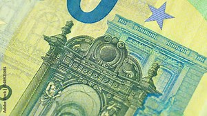 Closeup examination of 100 Euro banknotes, showcasing its features