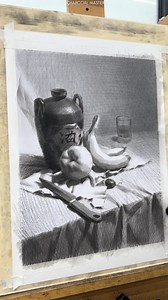 "The Poetry of Still Life – A Charcoal Masterpiece by Li Li Peng" In this meticulously crafted still life, Li Li Peng captures the quiet elegance of everyday objects. The interplay of light and shadow, combined with the textured depth of charcoal, evokes a timeless serenity. Each element, from the rustic jug to the gentle folds of the cloth, tells a story of simplicity and grace. #CharcoalArt #StillLifeDrawing #LiLiPeng #ArtisticMasters #CharcoalMasters #MonochromeArt #FineArt #RealisticArt #Art