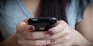 Schools are now required by state law to put 988 on the back of student ID’s