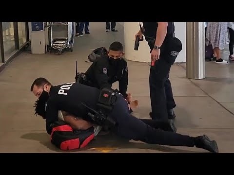 Aggressive panhandler harassing passengers Spitting at cops resisting arrest Tased by LAXPD
