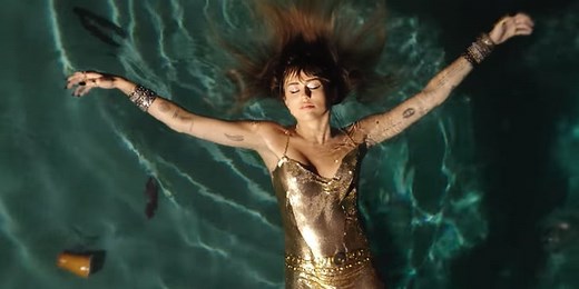 Zoom In on Miley Cyrus's Gold Chain-Mail Dress in Her Emotional "Slide Away" Music Video