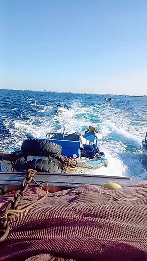 Exploring Small Fishing Boats in the Open Ocean