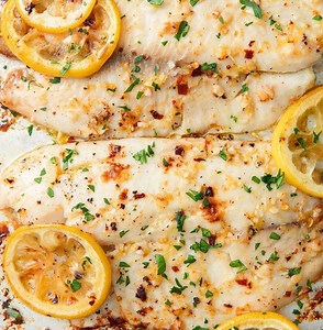 Garlicky Oven-Baked Tilapia is the summer dinner that won't weigh you down. Full recipe: http://dlsh.it/NS14PvP | Delish