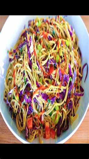 Asian Noodle Salad Recipe with Peanut Dressing Cold Asian Noodle Salad with a creamy Asian peanut dressing is full of veggies like cabbage, bell peppers, celery, and green onions. Perfect for meal prep, a barbecue, or an easy lunch salad! Ingredients 16 ounces whole wheat spaghetti 1 head green or red cabbage, thinly sliced 1 red bell pepper, diced 4 stalks of celery, chopped 4 green onions, sliced ¾ chopped fresh cilantro (can substitute parsley) Asian Peanut Dressing ⅓ cup peanut butter ¼ cup 