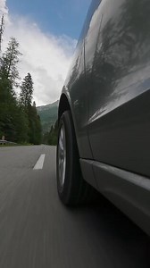 Car driving on scenic road side view