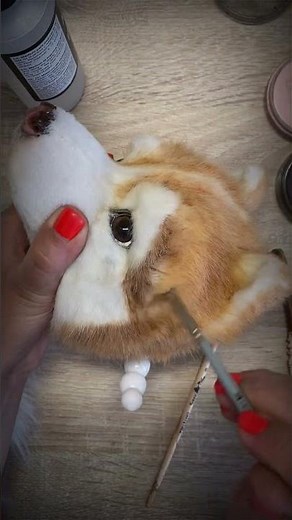 Sculptor transforms a dog’s head (sculpture) with realistic acrylic tinting