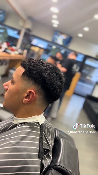 Chopstick Curls: The Trendy Mid Drop Fade Hairstyle