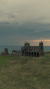 The magnificent ruins of Whitby Abbey in Yorkshire are set high on the clifftops overlooking the sea. Whitby Abbey is one of England’s most famous historical landmarks, the first monastery here was founded in 657 AD. #reels #history #whitby #explore #visitengland #explore #monastery #yorkshire #landscape #foryou #englandtravel #PlacesToVisit #UKBeautifulPlaces #AmazingPlaces | Exploring GB