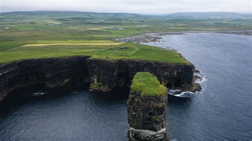 A coastline slowly breaking into the sea