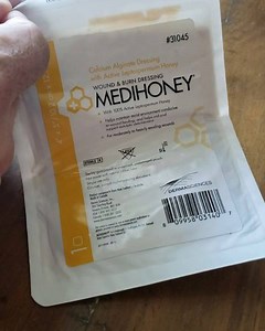Opening a medi-honey (manuka honey infused) calcium alginate dressing. They can be left on wounds for days at a time and encourage healing. #emt #medic #medihoney #survival #bushcraft #honey #naturalhealing | Coyne Survival Schools