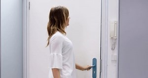 Delivery Man Giving Grocery Plastic Box To Woman