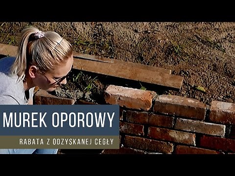 A wall made of old demolition bricks - a brick flowerbed