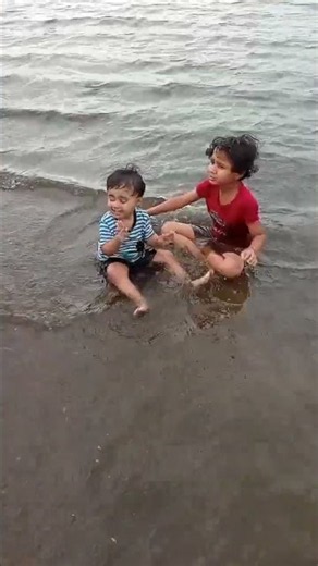 narayani shrisha playing Riverside children enjoying water activities kids fun water games