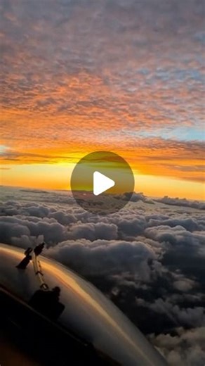 #pilotsdeck 🛩 on Instagram: "Watching the sunrise from the cockpit, surrounded by clouds, can be an incredible experience. As the sun begins to rise, its light often filters through the clouds, creating a stunning play of colors—warm oranges, pinks, and purples. The clouds themselves can appear as though they are glowing from within, making for a beautiful and serene view. The contrast between the dark clouds and the brightening sky adds to the drama and beauty of the scene. It’s a unique persp