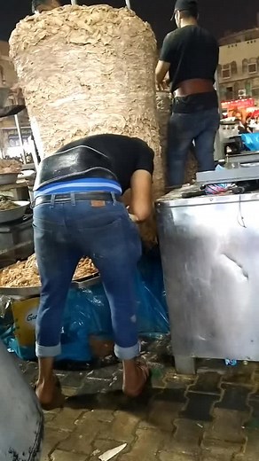 Preparing Delicious Bread at a Vibrant Outdoor Market