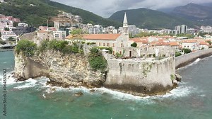 Budva, Montenegro. Drone footage. View of the Saint Ivan Church and old town. Adriatic coast, in the Mediterranean.