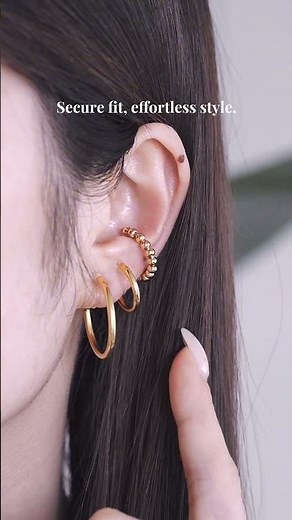 Classic gold hoops, no piercing needed.