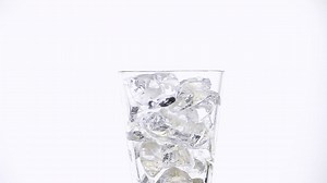 Pouring coke soda on a glass - Free Stock Video