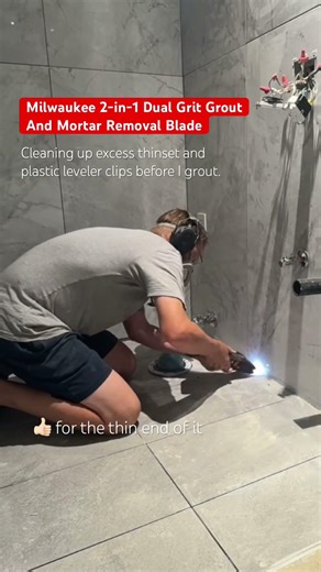 Cleaning up the mortar between my floor tiles before grouting with this Milwaukee tool.