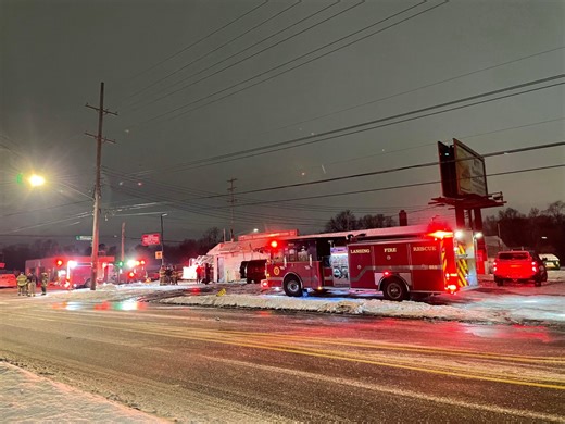 Car fire spreads to Lansing liquor store, causing damage