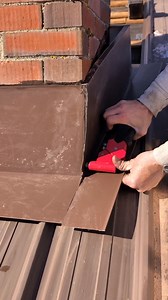 This is actually my first time grinding out the side of a chimney and installing the metal inside of it. But I actually really like this idea and I'm going to continue to do it for now on because I think it's a lot better than how I used to do it which is just tapcon it with a ton of silicone to the sides. I did add a couple tapcon screws to it and a few spots just to make sure it would stay. But most of it is just a really good silicone inside of the seams and then I squished it in there and th