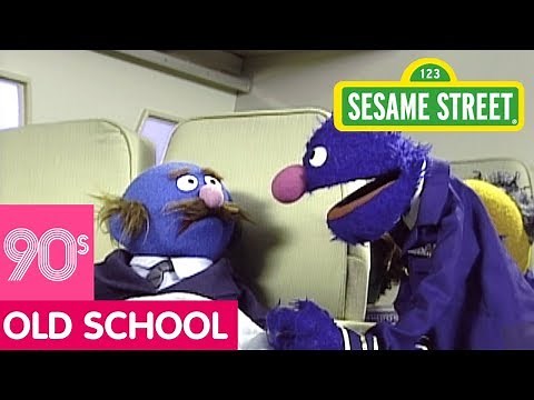Sesame Street: Grover the Flight Attendant Looks for Something to Read