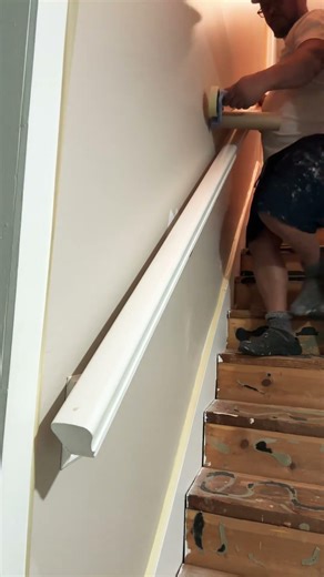 Using Scotch paper machine to cover stairs bannister from paint